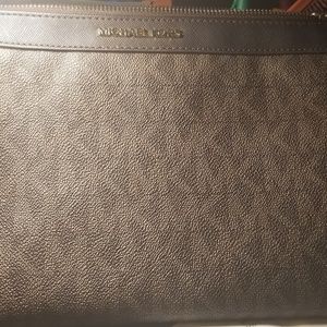 Michael Kors large wristlet.